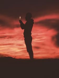 Preview wallpaper man, silhouette, fire, flame, dark