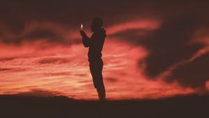 Preview wallpaper man, silhouette, fire, flame, dark