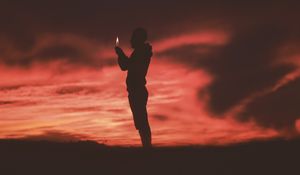 Preview wallpaper man, silhouette, fire, flame, dark