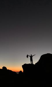 Preview wallpaper man, silhouette, freedom, loneliness, rocks, sunset