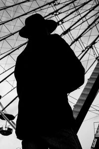 Preview wallpaper man, silhouette, hat, ferris wheel, alone, black and white