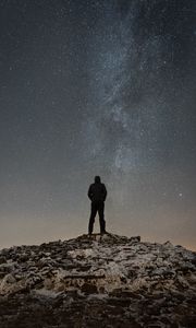 Preview wallpaper man, silhouette, hill, peak, starry sky