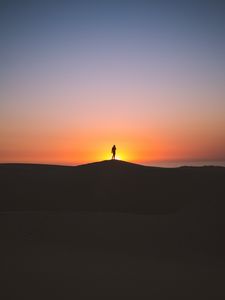 Preview wallpaper man, silhouette, horizon, sky, sunset