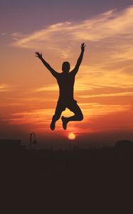 Preview wallpaper man, silhouette, jump, sky, sunset