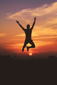 Preview wallpaper man, silhouette, jump, sky, sunset