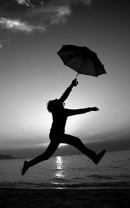 Preview wallpaper man, silhouette, jump, umbrella, black and white