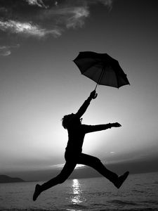 Preview wallpaper man, silhouette, jump, umbrella, black and white