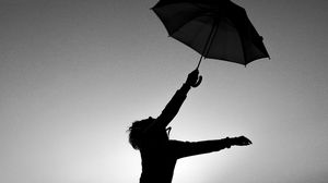 Preview wallpaper man, silhouette, jump, umbrella, black and white