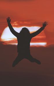 Preview wallpaper man, silhouette, jump, sunset, freedom