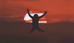 Preview wallpaper man, silhouette, jump, sunset, freedom