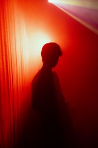 Preview wallpaper man, silhouette, light, red