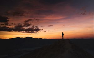 Preview wallpaper man, silhouette, loneliness, dusk, mountains