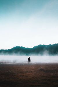 Preview wallpaper man, silhouette, loneliness, steam, lake