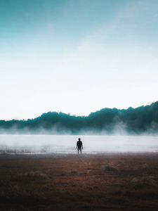 Preview wallpaper man, silhouette, loneliness, steam, lake