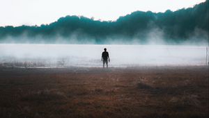 Preview wallpaper man, silhouette, loneliness, steam, lake