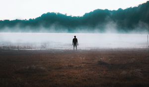 Preview wallpaper man, silhouette, loneliness, steam, lake