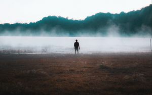 Preview wallpaper man, silhouette, loneliness, steam, lake