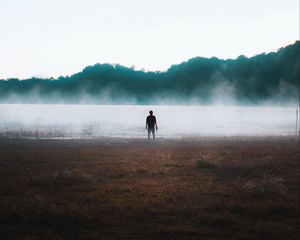 Preview wallpaper man, silhouette, loneliness, steam, lake
