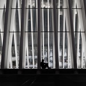 Preview wallpaper man, silhouette, loneliness, windows, building, architecture, bw