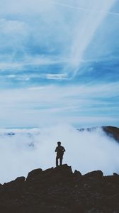 Preview wallpaper man, silhouette, mountains, clouds, top