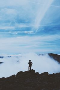 Preview wallpaper man, silhouette, mountains, clouds, top