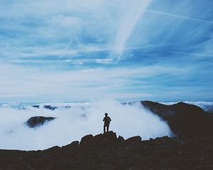 Preview wallpaper man, silhouette, mountains, clouds, top