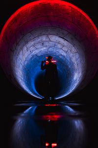 Preview wallpaper man, silhouette, neon, tunnel, dark