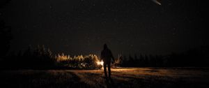 Preview wallpaper man, silhouette, night, flashlight, stars, starry sky