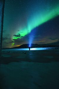 Preview wallpaper man, silhouette, northern lights, night, light, beam