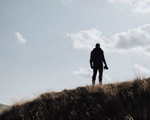 Preview wallpaper man, silhouette, photographer, hill, sky