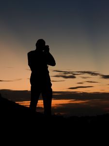 Preview wallpaper man, silhouette, photographer, sunset