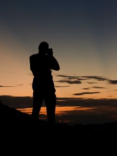 man on cell phone silhouette