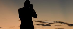 Preview wallpaper man, silhouette, photographer, sunset