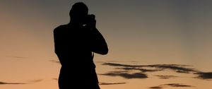 Preview wallpaper man, silhouette, photographer, sunset