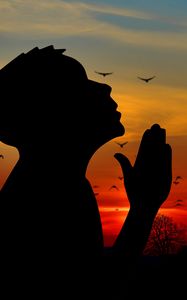 Preview wallpaper man, silhouette, prayer, sky