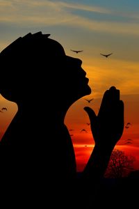 Preview wallpaper man, silhouette, prayer, sky