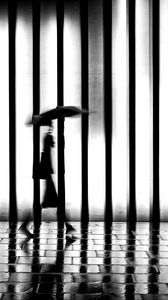 Preview wallpaper man, silhouette, rain, bw, lattice, movement