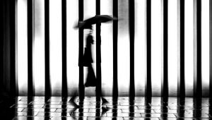 Preview wallpaper man, silhouette, rain, bw, lattice, movement