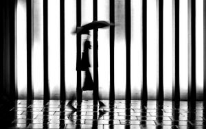 Preview wallpaper man, silhouette, rain, bw, lattice, movement