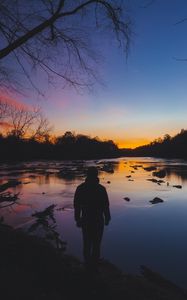 Preview wallpaper man, silhouette, river, trees, sky, solitude, harmony