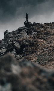 Preview wallpaper man, silhouette, rock, alone