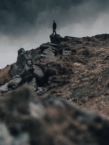 Preview wallpaper man, silhouette, rock, alone
