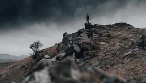Preview wallpaper man, silhouette, rock, alone