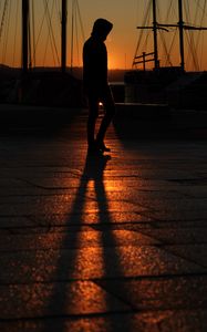 Preview wallpaper man, silhouette, shadow, sunset, dark