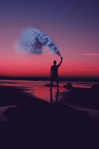 Preview wallpaper man, silhouette, smoke, shore, sunset, sea, asilah, morocco