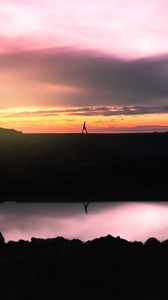 Preview wallpaper man, silhouette, sunset, horizon, reflection