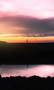 Preview wallpaper man, silhouette, sunset, horizon, reflection