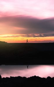 Preview wallpaper man, silhouette, sunset, horizon, reflection