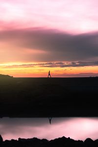 Preview wallpaper man, silhouette, sunset, horizon, reflection