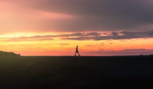 Preview wallpaper man, silhouette, sunset, horizon, reflection